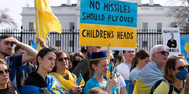 People protest the Russian invasion of Ukraine during a rally outside of the White House in Washington, Sunday, March 6.