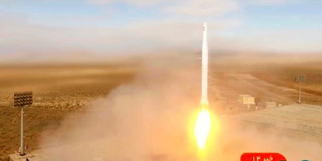 This image taken from video footage aired by Iranian state television on Tuesday, March 8, 2022, shows the launch of a rocket by Iran's Revolutionary Guard carrying a Noor-2 satellite in northeastern Shahroud Desert, Iran. 