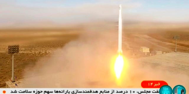 This image taken from video footage aired by Iranian state television on March 8, 2022, shows the launch of a rocket by Iran's Revolutionary Guard carrying a Noor-2 satellite in northeastern Shahroud Desert, Iran.