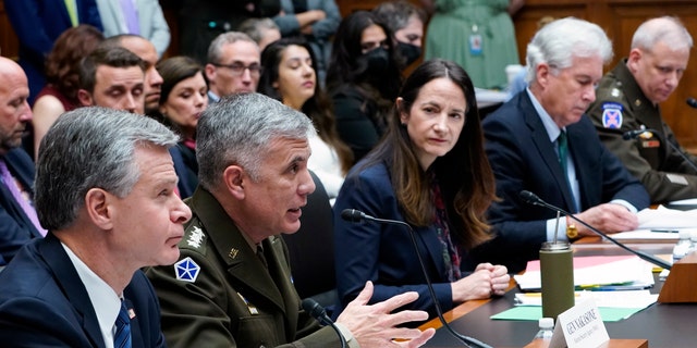 National Security Agency Director Gen. Paul Nakasone, second from left, testifies on Capitol Hill in Washington, Tuesday, March 8, 2022, during a House Permanent Select Committee on Intelligence hearing on worldwide threats. Joining him at the witness table is, from left, FBI Director Christopher Wray, Director of National Intelligence Avril Haines, Central Intelligence Agency Director William Burns, and Defense Intelligence Agency Director Lt. Gen. Scott Berrier. 