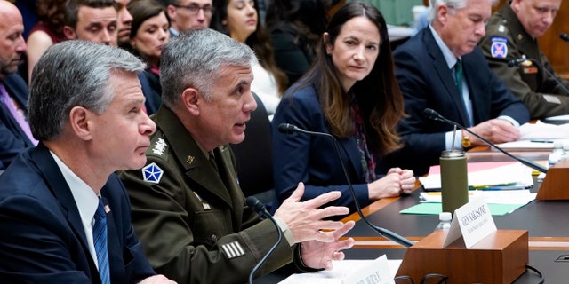 National Security Agency Director Gen. Paul Nakasone, second from left, testifies on Capitol Hill in Washington, Tuesday, March 8, 2022, during a House Permanent Select Committee on Intelligence hearing on worldwide threats. Joining him at the witness table is, from left, FBI Director Christopher Wray, Director of National Intelligence Avril Haines, Central Intelligence Agency Director William Burns, and Defense Intelligence Agency Director Lt. Gen. Scott Berrier. 