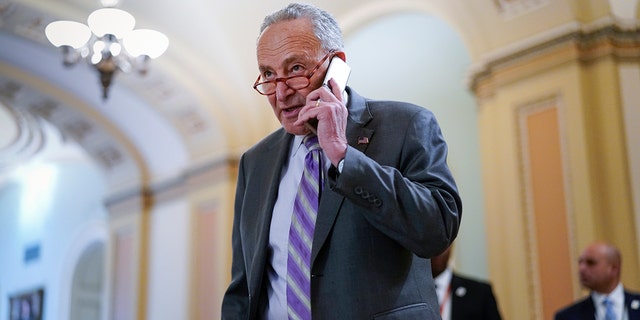 Senate Majority Leader Chuck Schumer, D-N.Y., arrives for a weekly policy luncheon, at the Capitol in Washington, Tuesday, March 8, 2022.