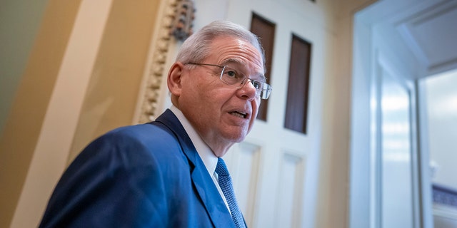 Senate Foreign Relations Chairman Robert Menendez, D-N.J., arrives to meet with fellow Democrats, at the Capitol in Washington, Tuesday, March 8, 2022.