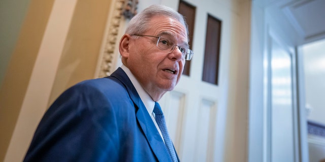 Senate Foreign Relations Chairman Robert Menendez, D-N.J., arrives to meet with fellow Democrats, at the Capitol in Washington, Tuesday, March 8, 2022.