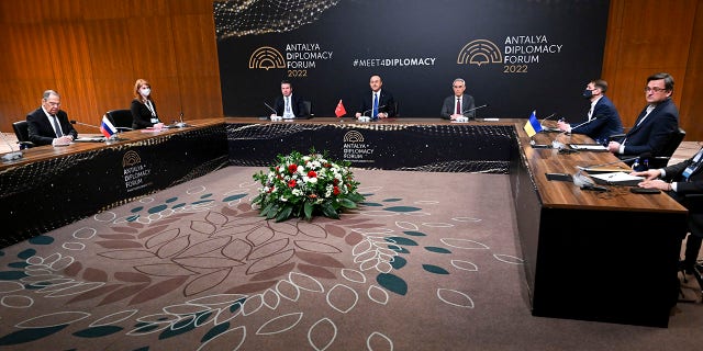 In this photo released by the Russian Foreign Ministry Press Service, Turkish Foreign Minister Mevlut Cavusoglu, center, chairs a tripartite meeting with Russia's Foreign Minister Sergey Lavrov, left, and Ukraine's Foreign Minister Dmytro Kuleba, right, in Antalya, Turkey, Thursday, March 10, 2022.Â