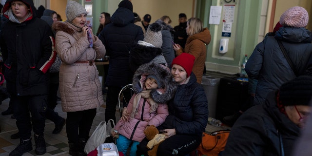 Ukrainian refugees wait at Przemysl train station in southeastern Poland on Friday, March 11, 2022. Thousands have been killed and more than 2.3 million have fled the country since Russian troops entered in Ukraine on February 24.