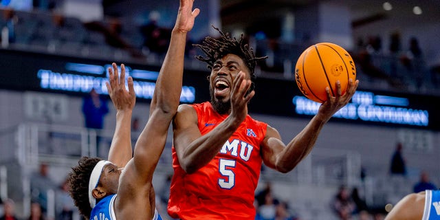 SMU guard Emmanuel Bandoumel (5) drives to the basket against Memphis center Malcom Dandridge (23) during the first half of an NCAA college basketball game in the semifinals of the American Athletic Conference tournament in Fort Worth, Texas, Saturday, March 12, 2022.