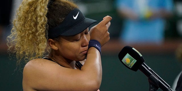 Naomi Osaka, of Japan, is emotional as she speaks to the crowd after losing her match to Veronika Kudermetova, of Russia, at the BNP Paribas Open tennis tournament Saturday, March 12, 2022, in Indian Wells, Calif.
