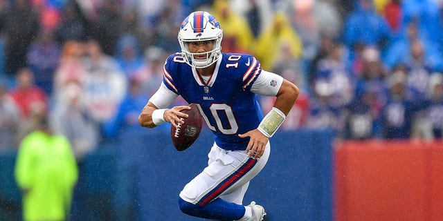 Buffalo Bills quarterback Mitchell Trubisky runs with the ball during the second half of an NFL football game against the Houston Texans in Orchard Park, N.Y., on Sunday, Oct. 3, 2021.