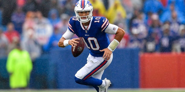 Buffalo Bills quarterback Mitchell Trubisky runs with the ball during the second half of an NFL football game against the Houston Texans in Orchard Park, N.Y., on Sunday, Oct. 3, 2021.