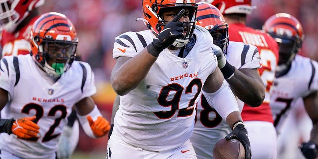 FILE - Cincinnati Bengals defensive end BJ Hill (92) celebrates after intercepting a pass during the second half of the AFC championship NFL football game against the Kansas City Chiefs, Sunday, Jan.  30, 2022, in Kansas City, Mo.  Hill has agreed to a free agent contract with the Bengals.
