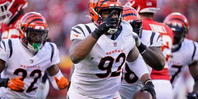 FILE - Cincinnati Bengals defensive end B.J. Hill (92) celebrates after intercepting a pass during the second half of the AFC championship NFL football game against the Kansas City Chiefs, Sunday, Jan. 30, 2022, in Kansas City, Mo. Hill has agreed to a free agent contract with the Bengals.