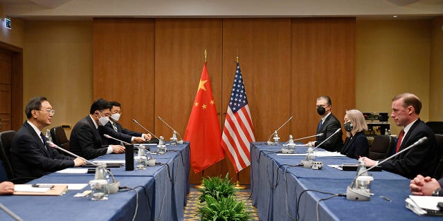 In this photo released by Xinhua News Agency, Yang Jiechi, a member of the Political Bureau of the Communist Party of China Central Committee and director of the Office of the Foreign Affairs Commission of the CPC Central Committee, left, meets with the U.S. adviser to national security Jake Sullivan at right in Rome, Italy, March 14, 2022.