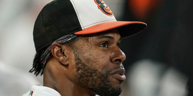 FILE - Baltimore Orioles center fielder Cedric Mullins looks on from the dugout after robbing a two-run home run off New York Yankees' Gary Sanchez during the second inning of a baseball game, Wednesday, Sept. 15, 2021, in Baltimore. Mullins' outstanding 2021 statistics for the Orioles appear even more impressive after learning of the compounding offseason surgery he had to overcome.