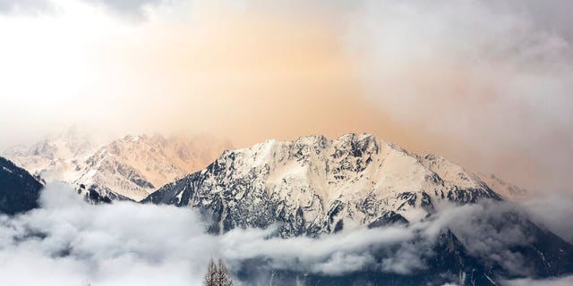 Dust from the Sahara desert can be seen above Le Catogne mountain as seen from Verbier, Switzerland.