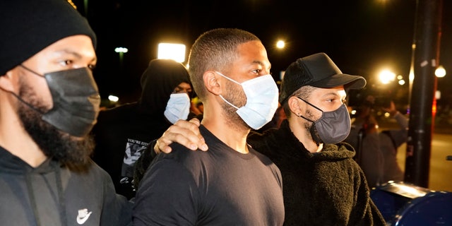 Actor Jussie Smollett, center, leaves the Cook County Jail on Wednesday, March 16, 2022.