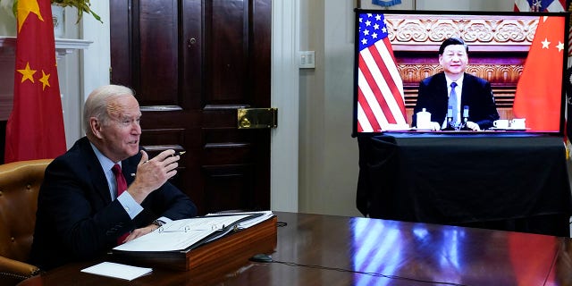 FILE - President Biden meets virtually with Chinese President Xi Jinping from the Roosevelt Room of the White House in Washington, on Nov. 15, 2021.