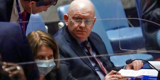 Russian Ambassador Vassily Nebenzia, right, speaks during a United Nations Security Council meeting on the humanitarian crisis in Ukraine on March 17, 2022, at UN headquarters. 