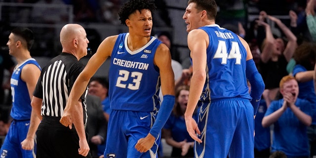 Creighton guard Trey Alexander (23) and forward Ryan Hawkins (44) celebrate a basket scored by Alexander in the second half of a first-round game against San Diego State in the NCAA college basketball tournament in Fort Worth, Texas, Thursday,