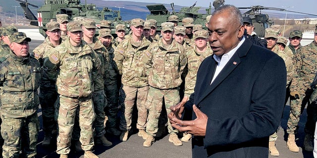 Defense Secretary Lloyd Austin speaks with U.S. troops, Friday, March 18, 2022 at an Army training range in Bulgaria.  Austin was in Bulgaria to meet with U.S. troops and to consult with top Bulgarian government officials.  