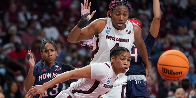 South Carolina forward Aliyah Boston, top, and guard Zia Cooke, bottom, look at a loose ball during the first half of a first round game against Howard in the NCAA women's college basketball tournament Friday, March 18, 2022 in Columbia, S.C.