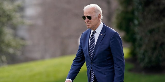 President Biden walks on the South Lawn of the White House before boarding Marine One on March 18, 2022.