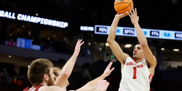 Wisconsin's Johnny Davis shoots during the first half of a first round NCAA college basketball tournament game against Colgate Friday, March 18, 2022, in Milwaukee.