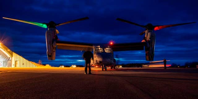 U.S. Marines inspect a MV-22B Osprey prior to flight at Norwegian Air Force Base Bodo during Exercise Cold Response 22, Norway, March 16, 2022. 