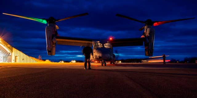 U.S. Marines inspect a MV-22B Osprey prior to flight at Norwegian Air Force Base Bodo during Exercise Cold Response 22, Norway, March 16, 2022.