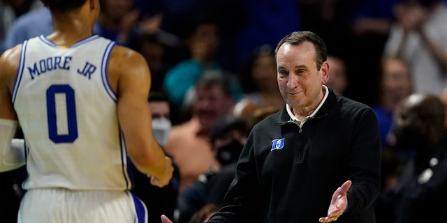 Duke head coach Mike Krzyzewski celebrates after their win against Michigan State with forward Wendell Moore Jr. during the second half of a college basketball game in the second round of the NCAA tournament on Sunday, March 20, 2022, in Greenville, S.C.