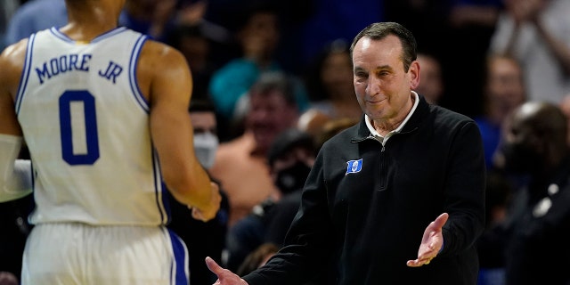 Duke head coach Mike Krzyzewski celebrates after their win against Michigan State with forward Wendell Moore Jr. during the second half of a college basketball game in the second round of the NCAA tournament on Sunday, March 20, 2022, in Greenville, S.C.