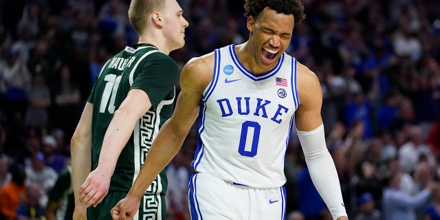 Duke forward Wendell Moore Jr. celebrates after their win as Michigan State forward Joey Hauser looks away during in a college basketball game in the second round of the NCAA tournament on Sunday, March 20, 2022, in Greenville, S.C.