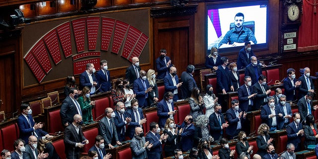 Ukrainian President Volodymyr Zelenskyy addresses the Italian parliament via video link, in Rome, Tuesday, March 22, 2022. 