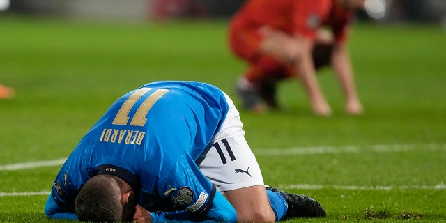 Italy's Domenico Berardi knees after missing a scoring chance during the World Cup qualifying play-off soccer match between Italy and North Macedonia, at Renzo Barbera stadium, in Palermo, Italy, Thursday, March 24, 2022.