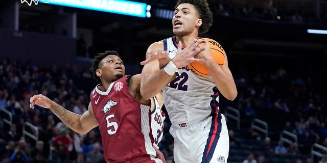 Gonzaga forward Anton Watson (22) grabs a rebound against Arkansas guard Au'Diese Toney (5) during the first half of a college basketball game in the Sweet 16 round of the NCAA tournament in San Francisco, Thursday, March 24, 2022.