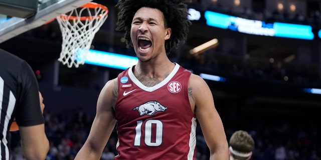 Arkansas forward Jaylin Williams reacts after dunking against Gonzaga during the first half of a college basketball game in the Sweet 16 round of the NCAA tournament in San Francisco, Thursday, March 24, 2022.