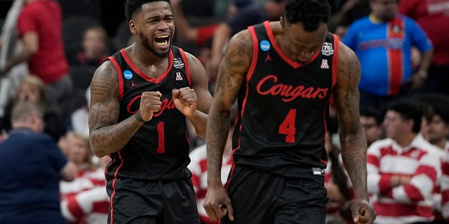 Houston guard Taze Moore, right, celebrates their win against Arizona with guard Jamal Shead during the second half of a college basketball game in the Sweet 16 round of the NCAA tournament on Thursday, March 24, 2022, in San Antonio.