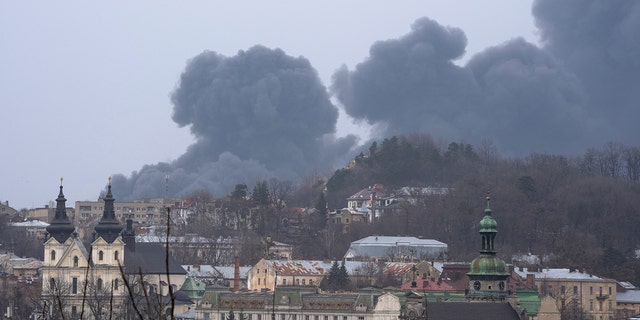 Smoke rises in the air in Lviv, western Ukraine, Saturday, March 26, 2022.  (AP Photo/Nariman El-Mofty)