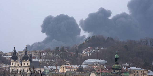 Smoke rises in the air in Lviv, western Ukraine, Saturday, March 26, 2022. (AP Photo/Nariman El-Mofty)