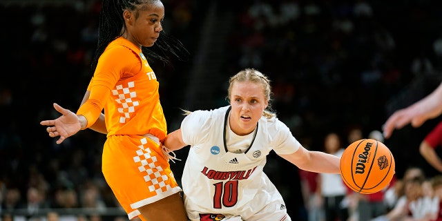Louisville's Hailey Van Lith heads to the basket as Tennessee's Jordan Walker defends in the Sweet 16 round of the NCAA women's tournament Saturday, March 26, 2022, in Wichita, Kansas.