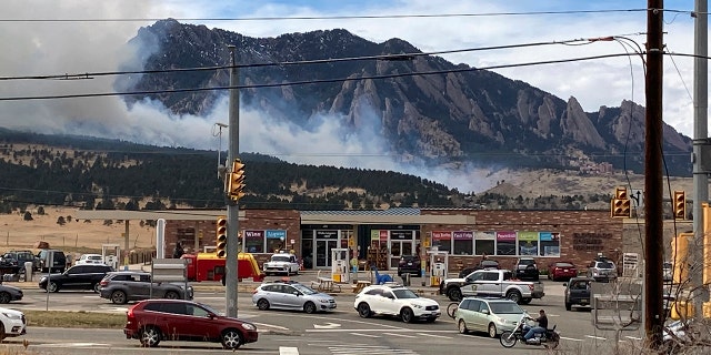 Smoke billows from a wildfire Saturday, March 26, 2022 in Marshall, Colo., a few miles south of Boulder, Colo. (AP Photo/Dave Zelio)