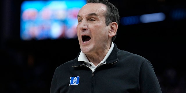 Duke head coach Mike Krzyzewski reacts toward players during the first half of his team's college basketball game against Arkansas in the Elite 8 round of the NCAA men's tournament in San Francisco, Saturday, March 26, 2022. (AP Photo/Tony Avelar)