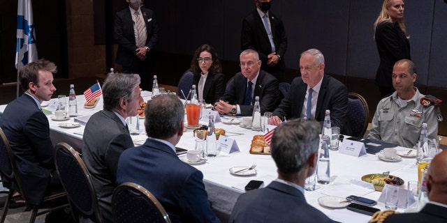 U.S. Secretary of State Antony Blinken, across table second from left, meets with Israel's Defense Minister Benny Gantz, across table second from right, at the David Citadel Hotel in Jerusalem, Sunday, March 27, 2022, in Jerusalem. 