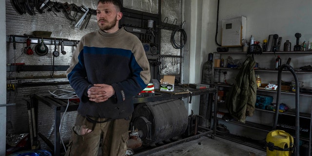 Car welder Ostap Datsenko, 31, pauses during an interview at a welding workshop in Lviv, western Ukraine, Sunday, March 27, 2022.