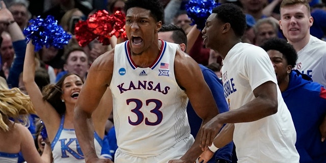 Kansas' David McCormack reacts after making a shot and being fouled in the Elite 8 round of the NCAA tournament Sunday, March 27, 2022, in Chicago.