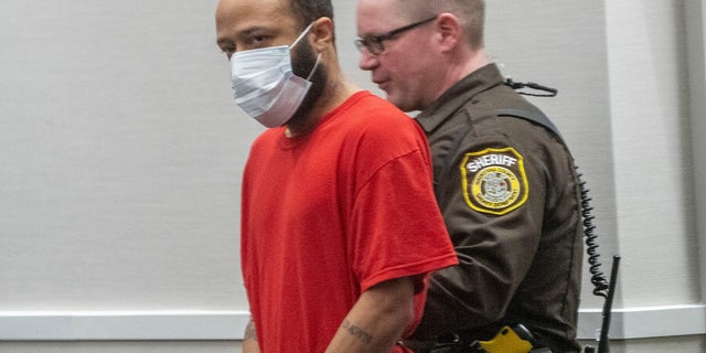 Darrell Brooks Jr., enters the Waukesha County Courthouse courtroom in Waukesha, Wis., on Tuesday, March 29, 2022. Brooks Jr. is accused of killing six people and injuring more than 60 at the Waukesha Christmas Parade last year. 