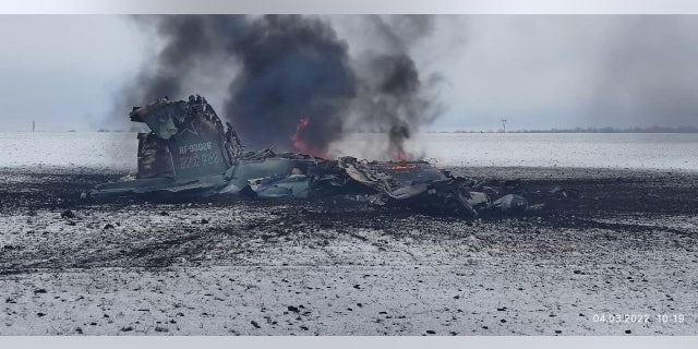 Ukrainian military officials say the wreckage is the remains of a Russian Air Force assault aircraft, in a field outside the town of Volnovakha in the Donetsk region, Ukraine, in this handout picture released March 4, 2022.