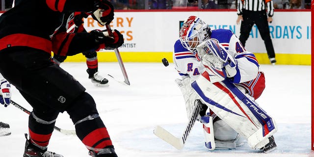 Carolina Hurricanes' Jordan Staal (11) has his shot blocked by New York Rangers goaltender Alexandar Georgiev (40) during the second period of an NHL hockey game in Raleigh, N.C., Sunday, March 20, 2022.