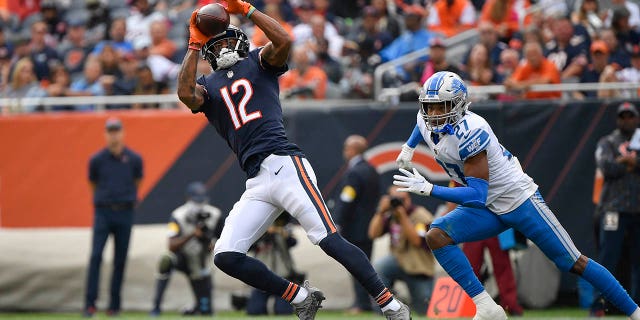 Oct 3, 2021; Chicago, Illinois, USA; Chicago Bears wide receiver Allen Robinson (12) catches the ball for a first down in the second half against Detroit Lions defensive back Bobby Price (27) at Soldier Field.