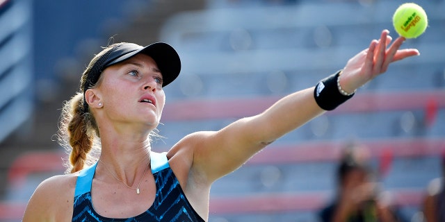 Kristina Mladenovic of France serves against Anastasia Potapova of Russia (not pictured) in second-round qualifying play at Stade IGA on Aug. 8, 2021, in Montreal, Quebec.